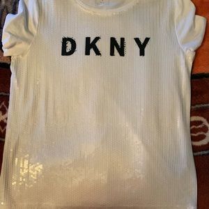 White t-shirt with sequence on the fright and a plain  back